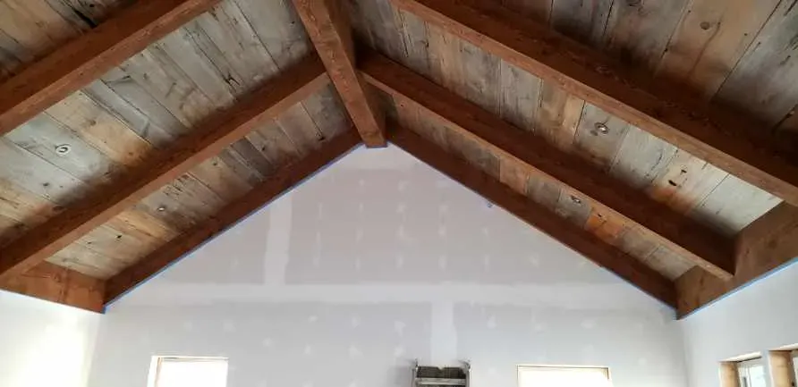 Finished interior with exposed timbers along the roofline