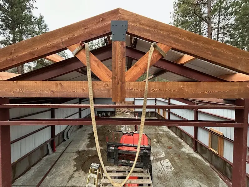 Heavy timber roof frame shown during construction