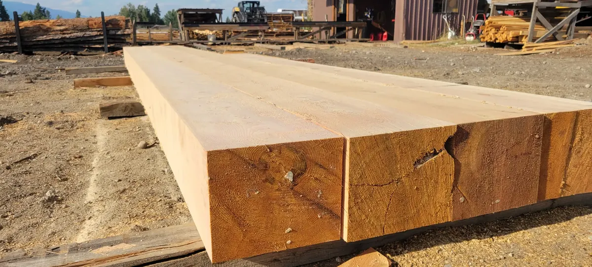 Massive square timbers freshly cut at the mill