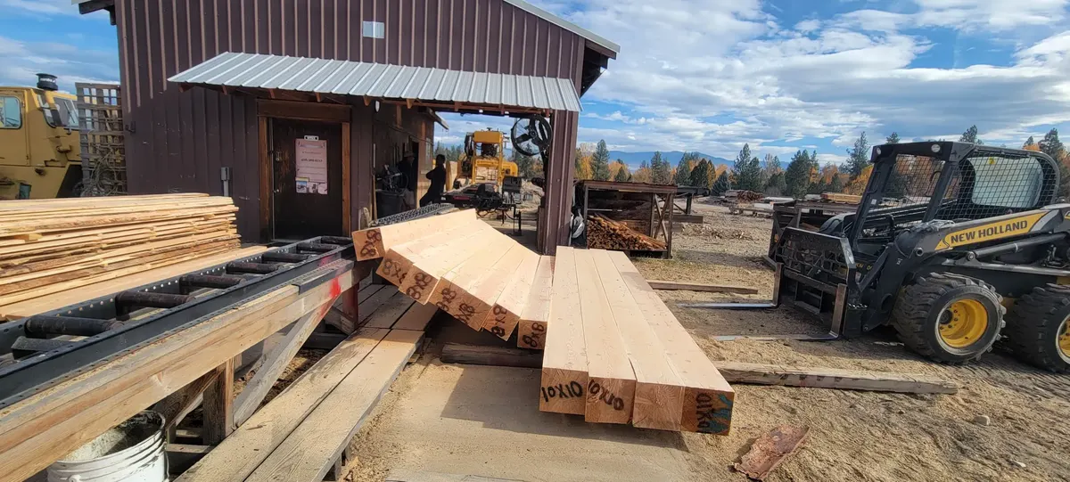 Loader and fresh-cut lumber at the mill